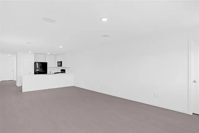 a house that has a couple of table in it