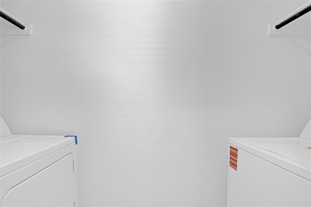 1033 Raintree Road Princeton, TX 75407 - Photo 26 of 26 a utility room with dryer and washer