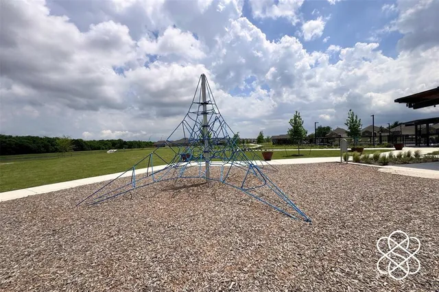a view of a chairs and table in patio