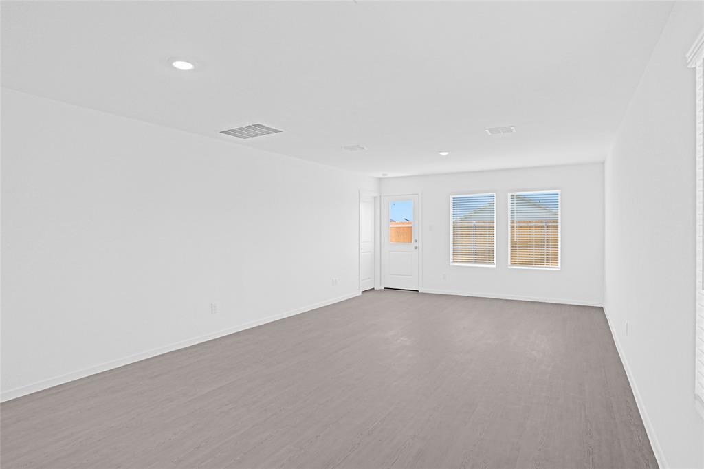 1033 Raintree Road Princeton, TX 75407 - Photo 10 of 25 an empty room with a windows and closet