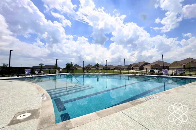 a bedroom with a bed and a flat tv screen in it