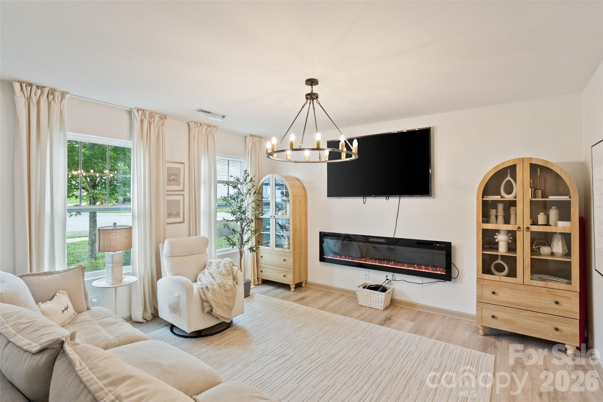 8726 Conrad Street Locust, NC 28097 - Photo 5 of 36 a living room with furniture and a flat screen tv
