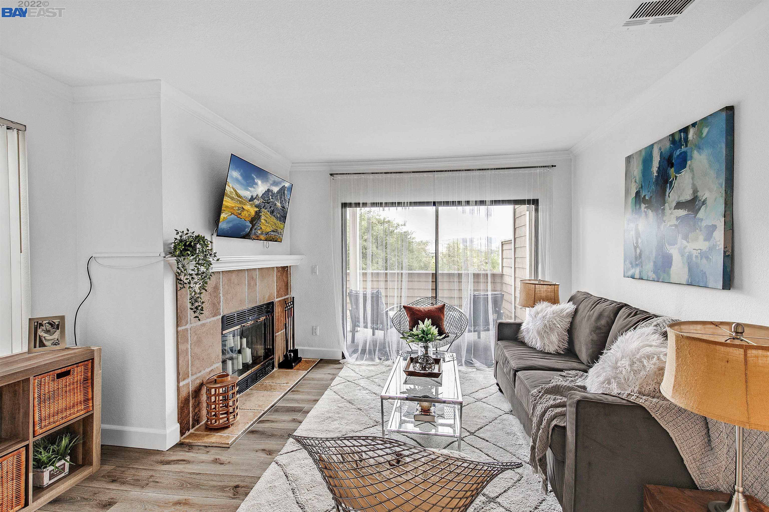 148 Eastridge Drive San Ramon, CA 94582 - Photo 1 of 1 a living room with furniture a fireplace and a flat screen tv