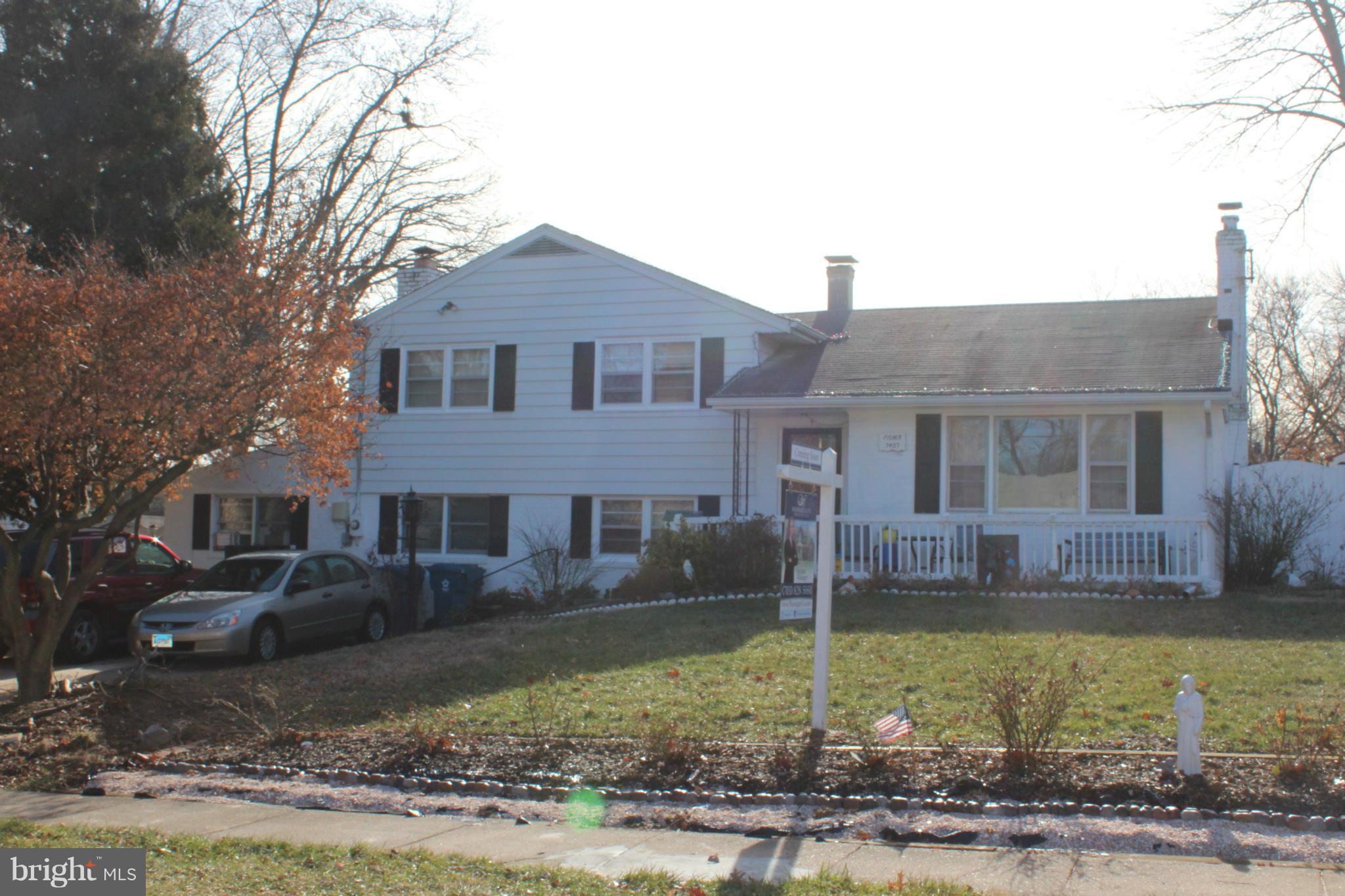 7407 Farnum Street Springfield, VA 22151 - Photo 1 of 1 a front view of a house with garden