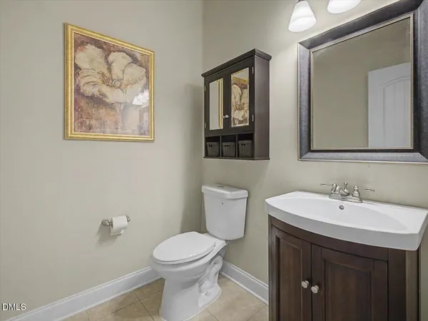a view of a dining room with furniture a rug and wooden floor