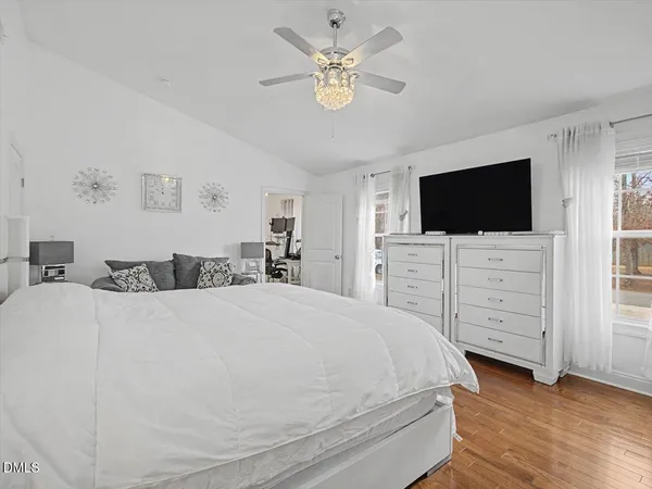 a large white bed in a white room