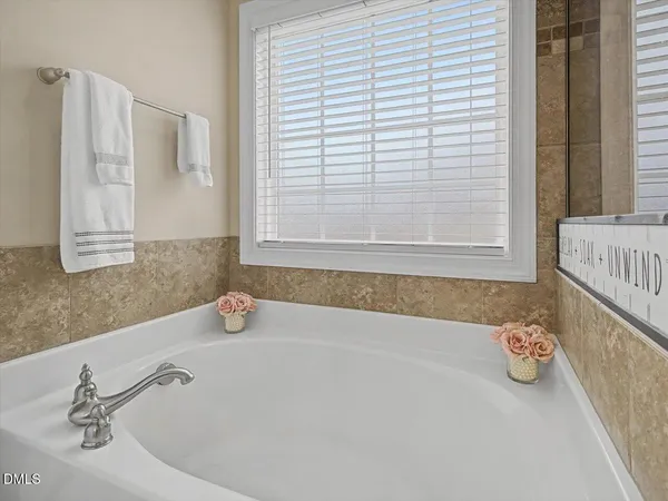 a bathroom with a shower and a sink
