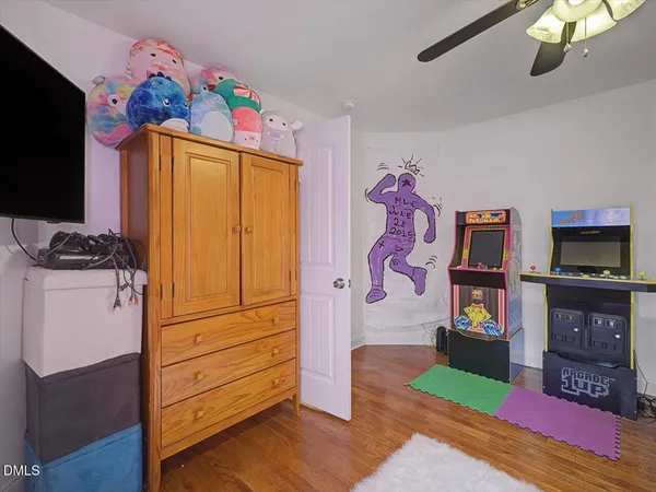 a view of a house with a wooden fence