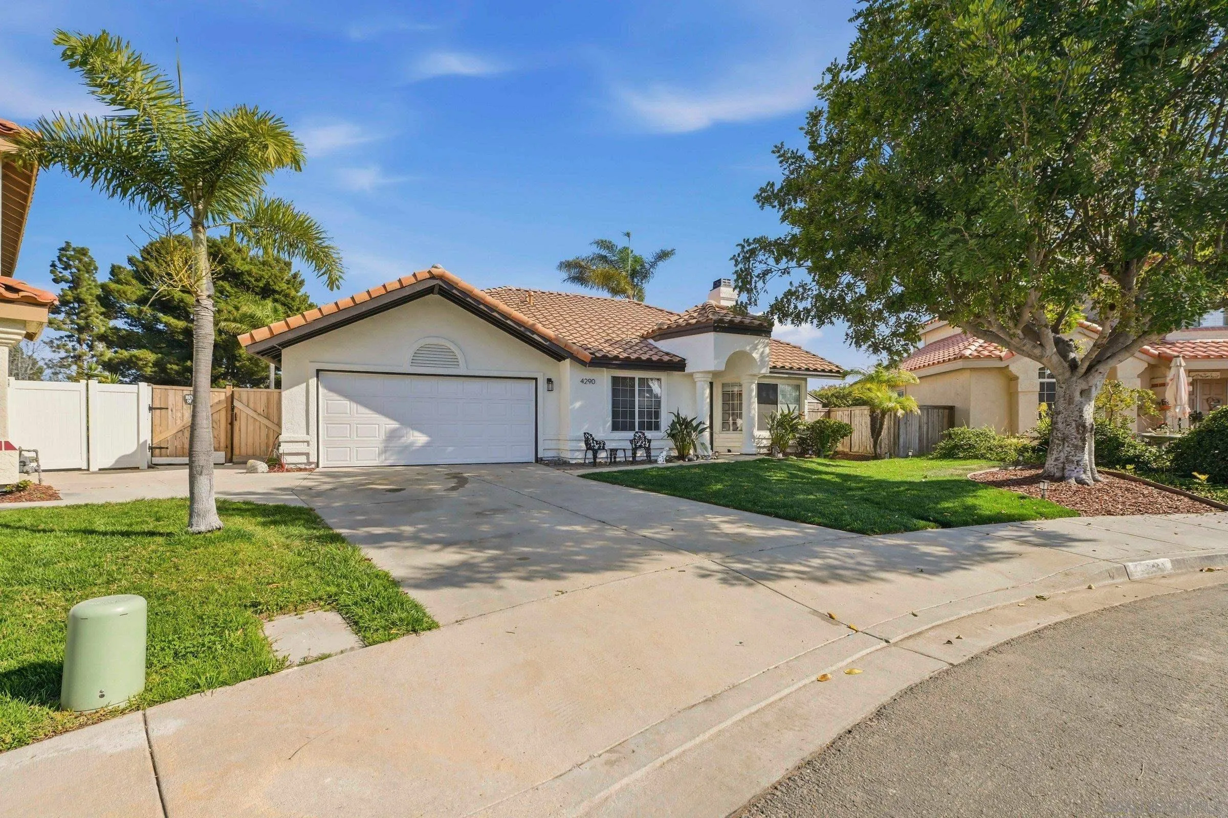 4290 Via Clemente Oceanside, CA 92057 - Photo 1 of 34 a front view of a house with a yard and garage
