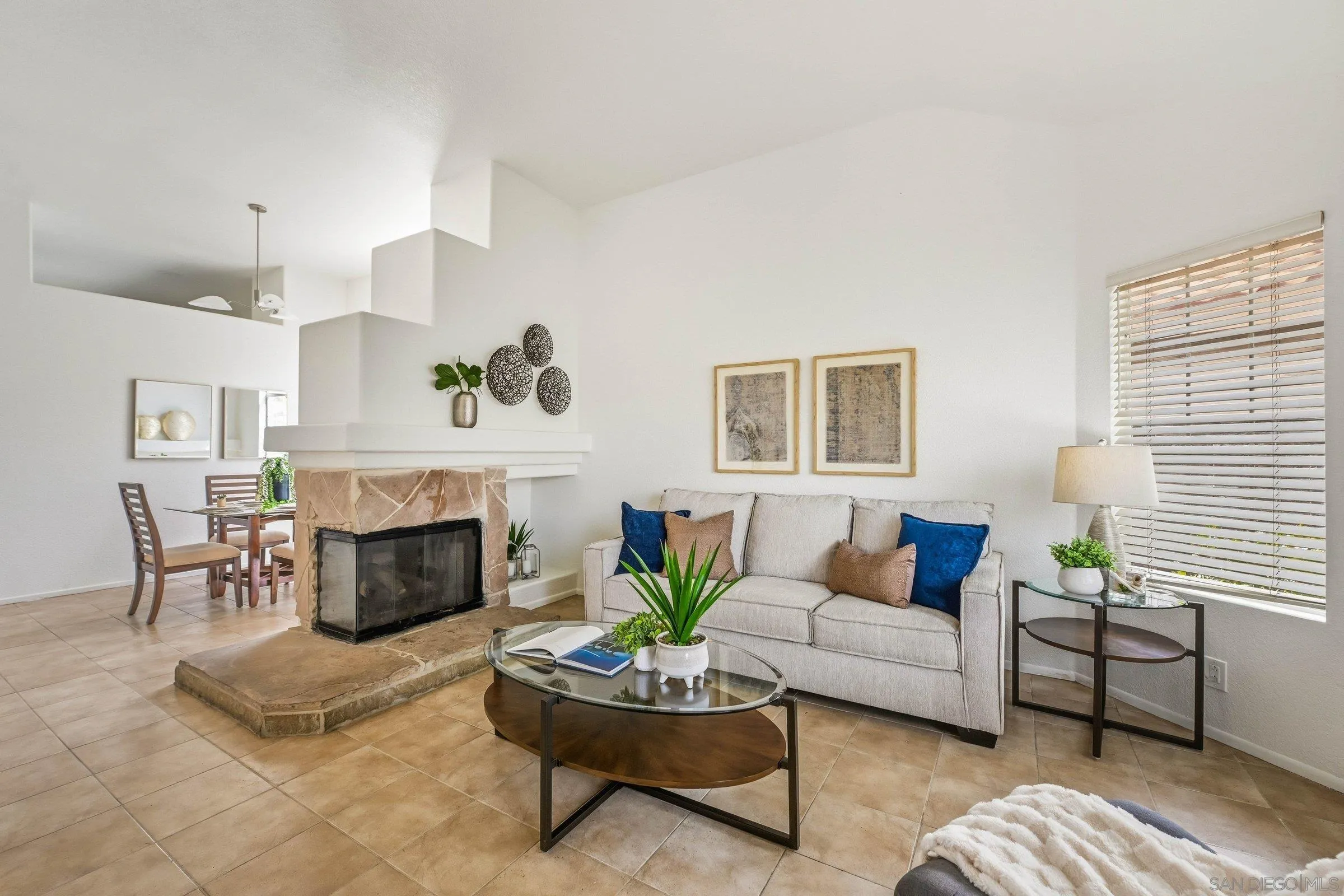 4290 Via Clemente Oceanside, CA 92057 - Photo 3 of 34 a living room with furniture a fireplace and a potted plant