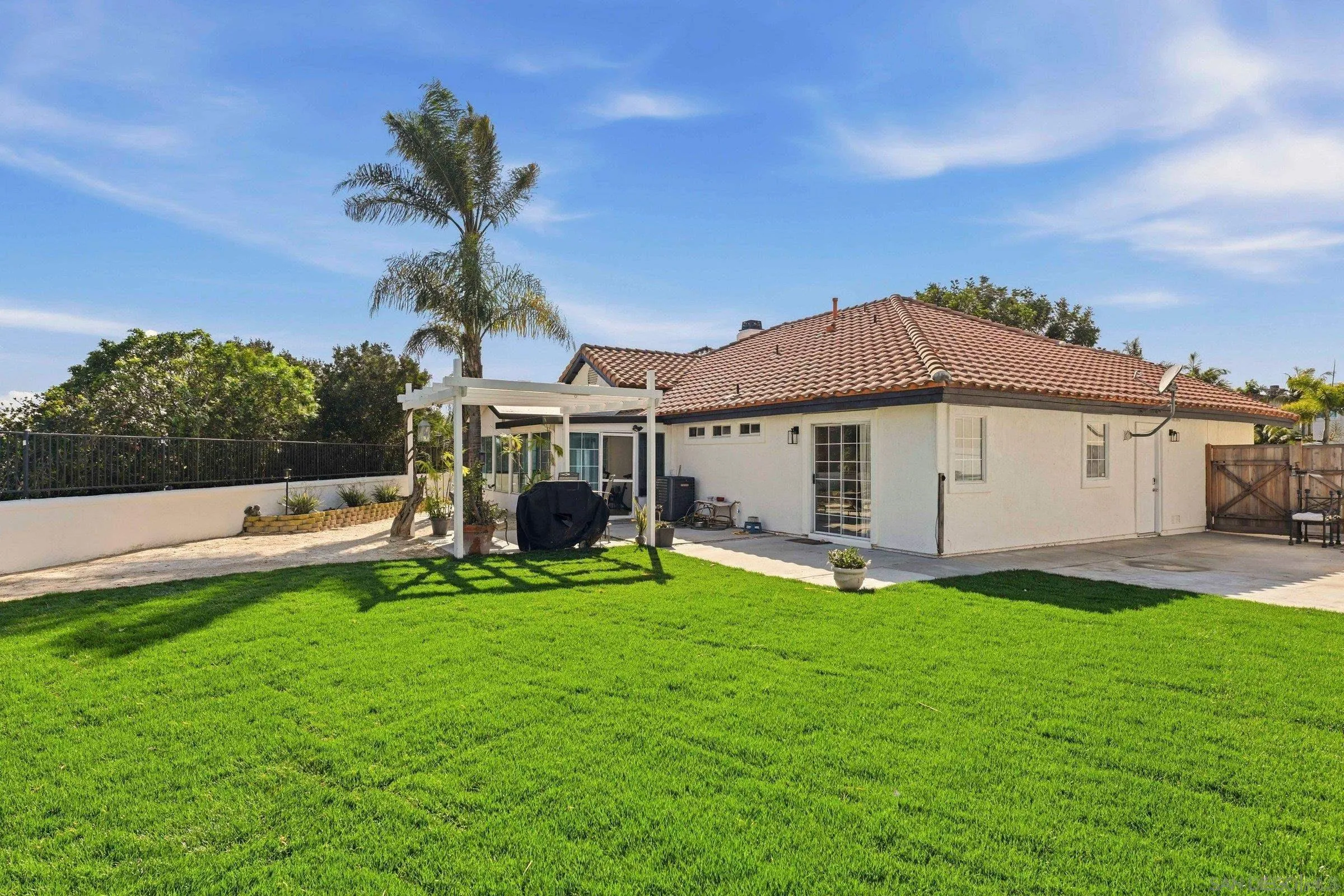 4290 Via Clemente Oceanside, CA 92057 - Photo 32 of 34 a view of a house with a yard and sitting area