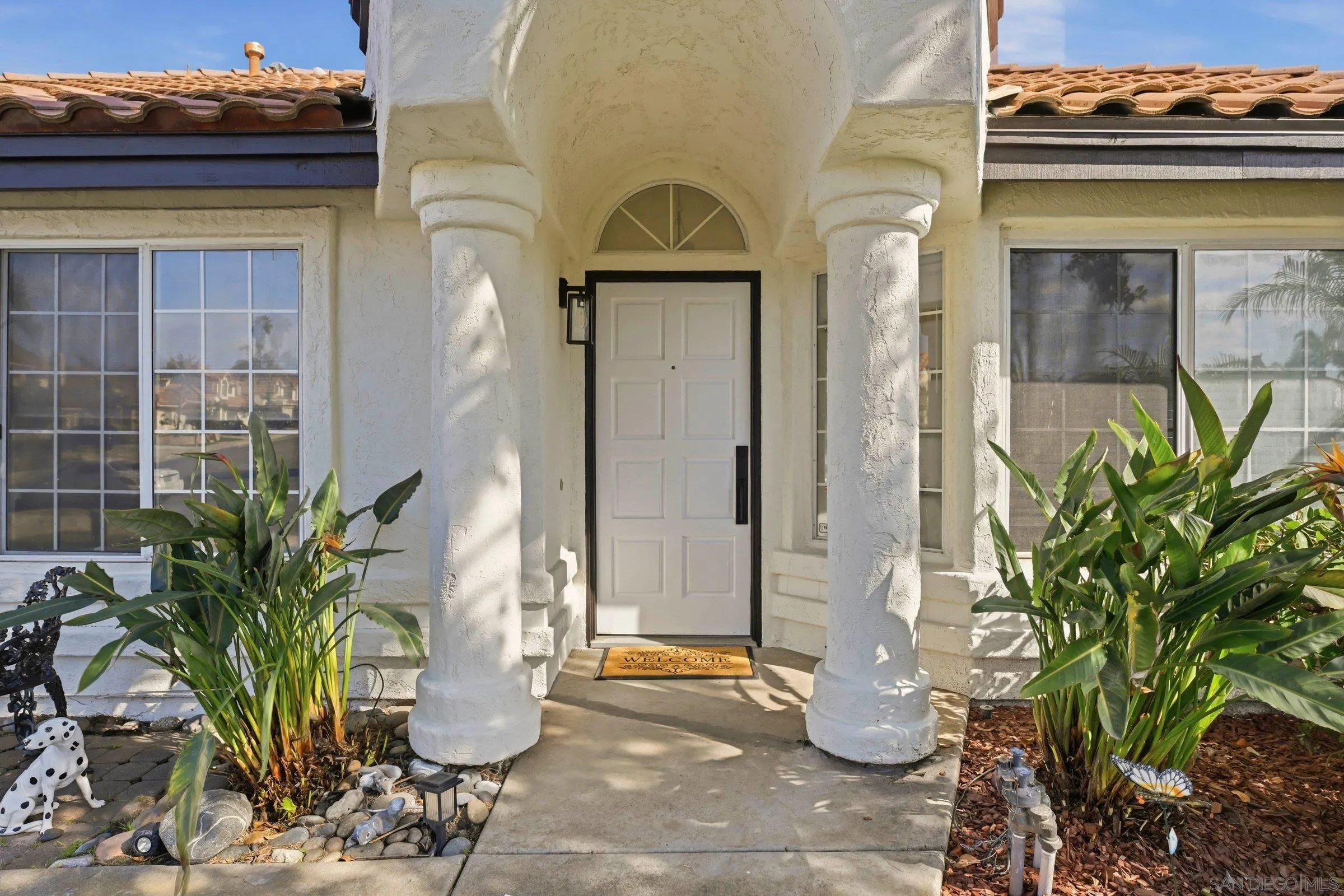 4290 Via Clemente Oceanside, CA 92057 - Photo 6 of 34 a potted plant sitting in front of a glass door