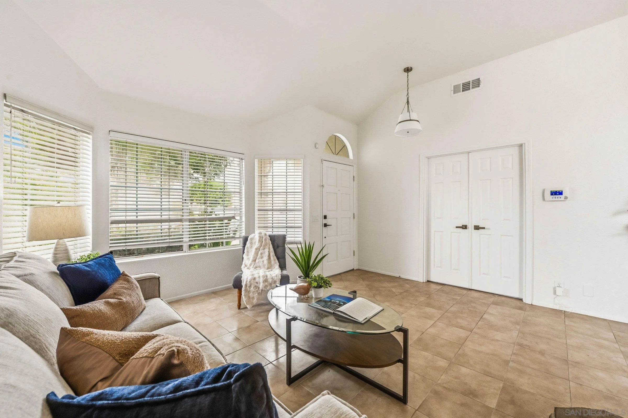 4290 Via Clemente Oceanside, CA 92057 - Photo 7 of 34 a living room with furniture and a large window