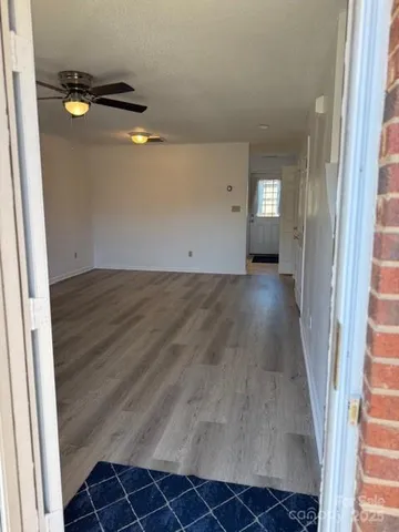 a view of a livingroom with wooden floor