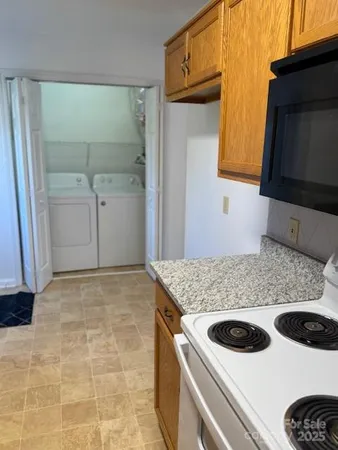 a kitchen with a stove and a microwave