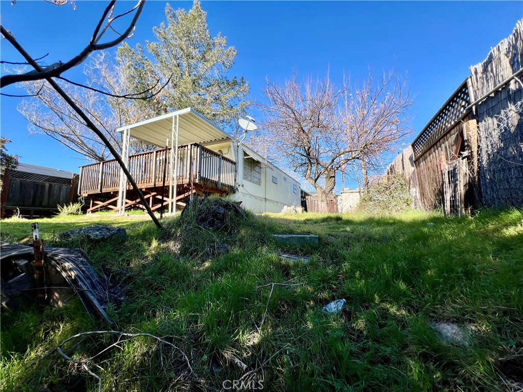 13517 Arrowhead Road Clearlake, CA 95422 - Photo 12 of 37 a view of a house with a big yard plants and large trees