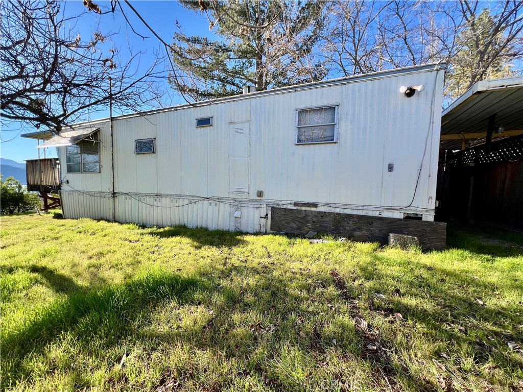 13517 Arrowhead Road Clearlake, CA 95422 - Photo 13 of 37 a view of a backyard of the house