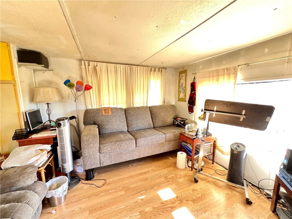 13517 Arrowhead Road Clearlake, CA 95422 - Photo 17 of 37 a living room with furniture and a flat screen tv