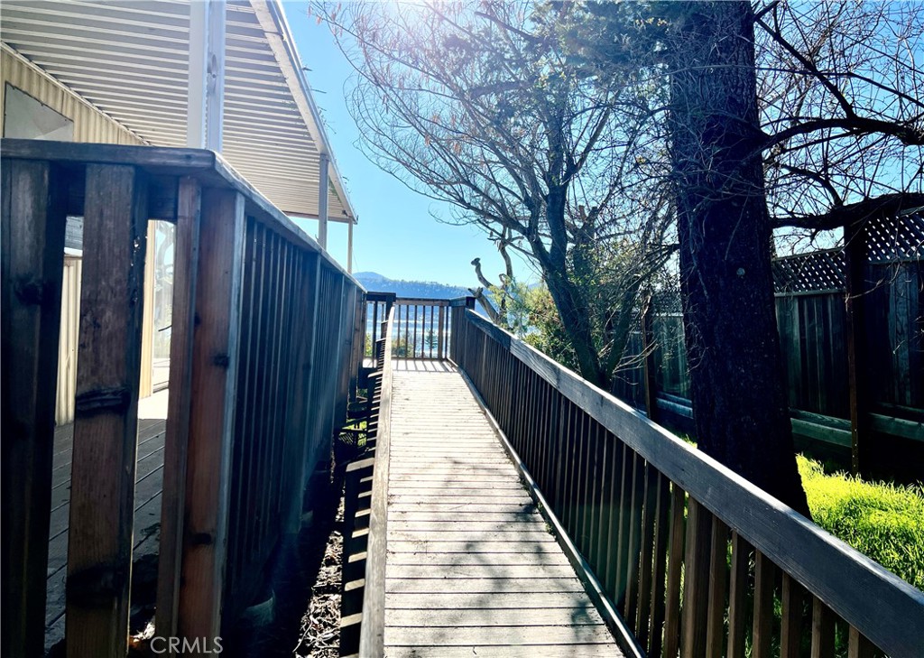 13517 Arrowhead Road Clearlake, CA 95422 - Photo 32 of 37 a view of balcony with wooden floor and fence