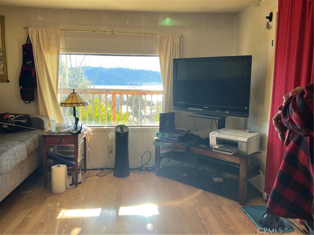 13517 Arrowhead Road Clearlake, CA 95422 - Photo 6 of 37 a living room with patio furniture and a flat screen tv