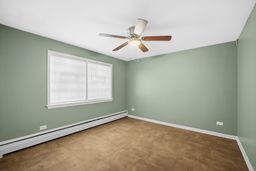 9209 South State Street Chicago, IL 60619 - Photo 13 of 20 an empty room with a window and a fan