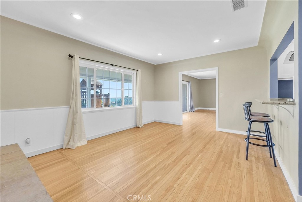 918 Dorothea Road La Habra Heights, CA 90631 - Photo 12 of 42 a view of an empty room with window and wooden floor