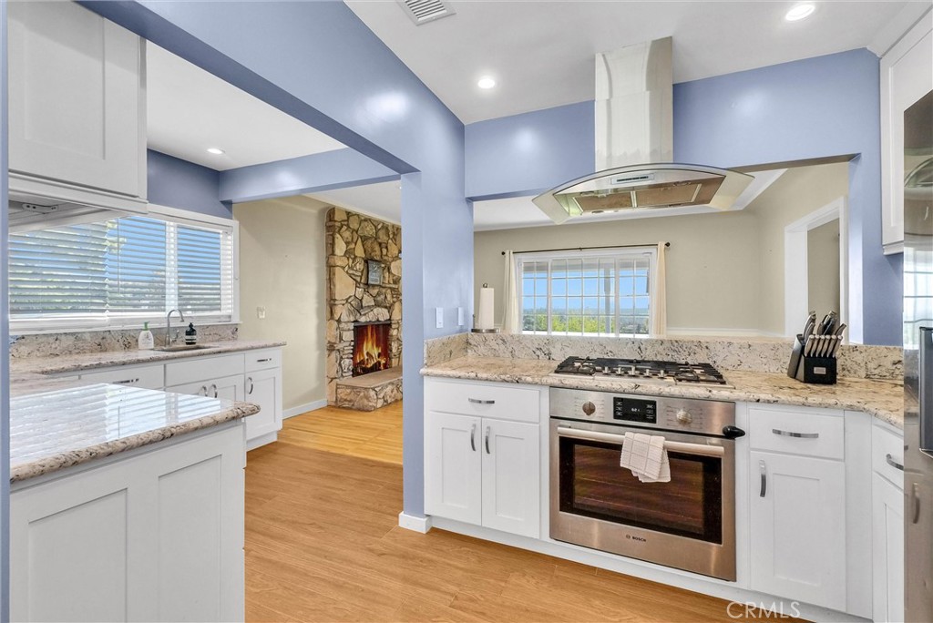 918 Dorothea Road La Habra Heights, CA 90631 - Photo 16 of 42 a kitchen with a stove oven and sink