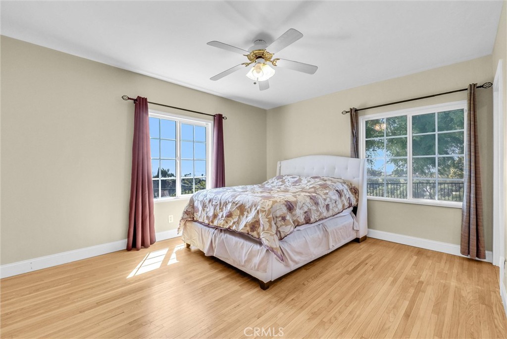 918 Dorothea Road La Habra Heights, CA 90631 - Photo 18 of 42 a bedroom with a large bed and a large window