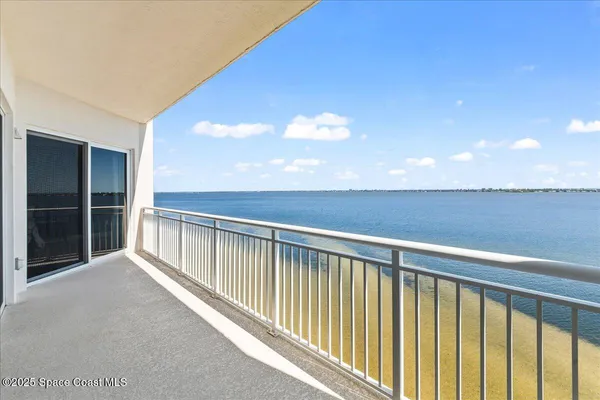 a view of balcony with furniture