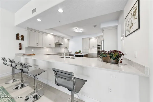 a living room with furniture and white walls