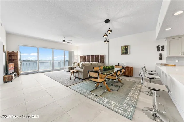 a living room with furniture and white walls