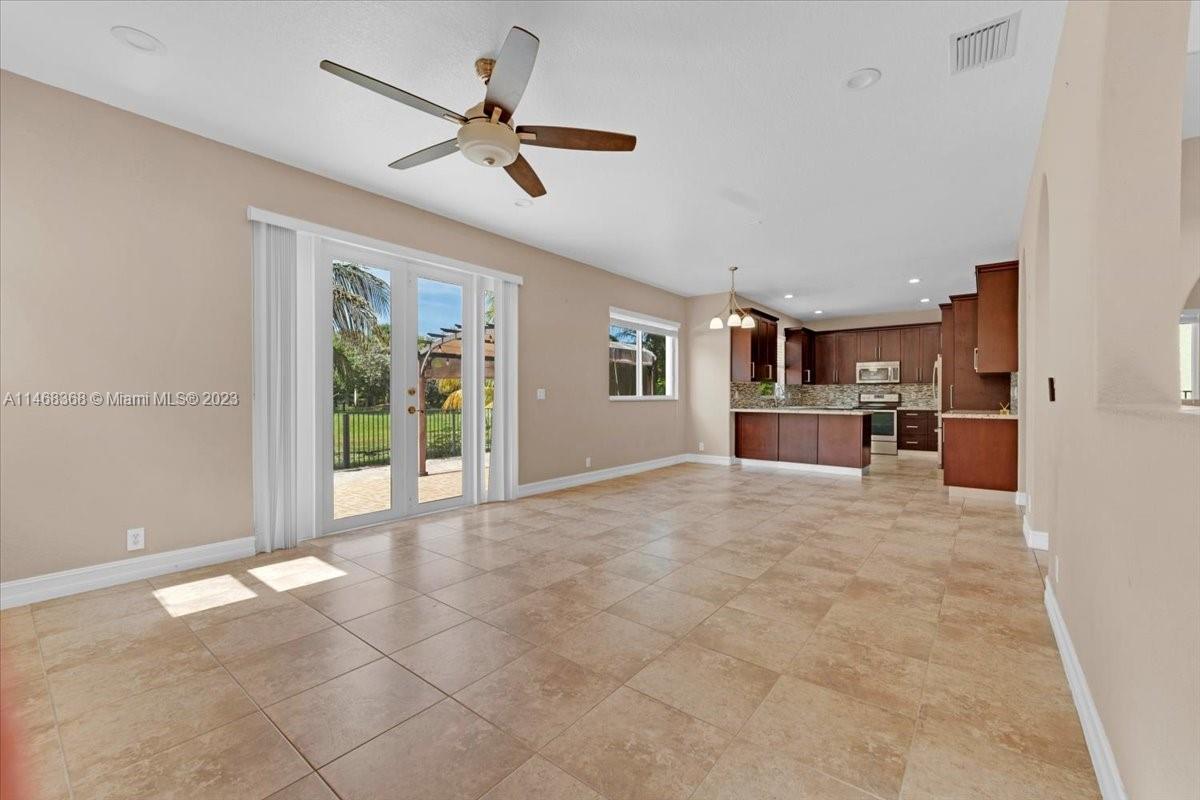 12441 Southwest 1st Street Plantation, FL 33325 - Photo 11 of 37 a view of a kitchen with a sink and refrigerator