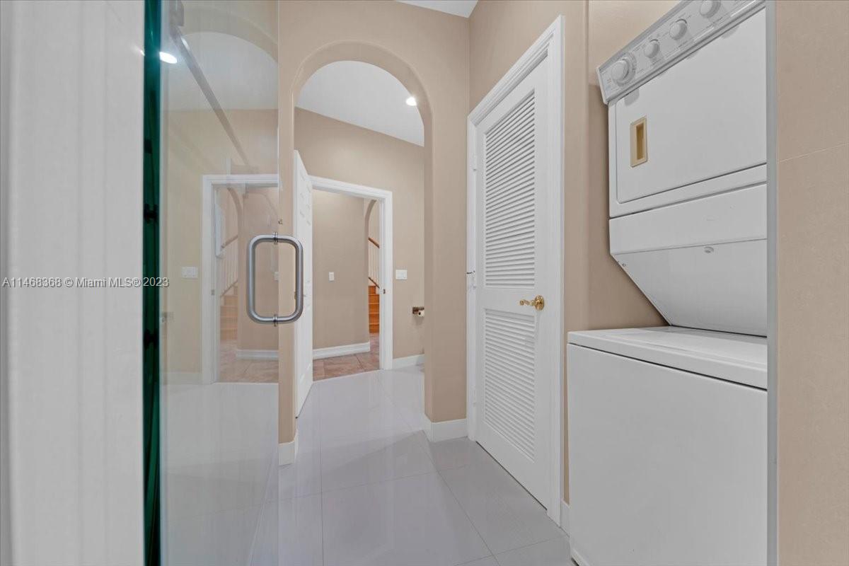 12441 Southwest 1st Street Plantation, FL 33325 - Photo 13 of 37 a view of a storage & utility room with washer and dryer