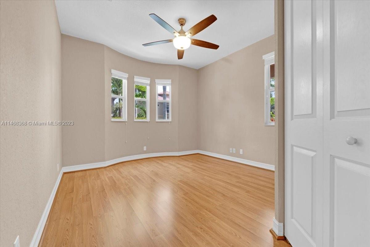 12441 Southwest 1st Street Plantation, FL 33325 - Photo 14 of 37 a view of an empty room with window and a chandelier fan