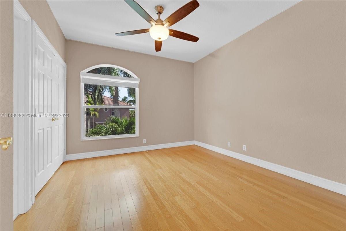 12441 Southwest 1st Street Plantation, FL 33325 - Photo 16 of 37 wooden floor in an empty room with a window