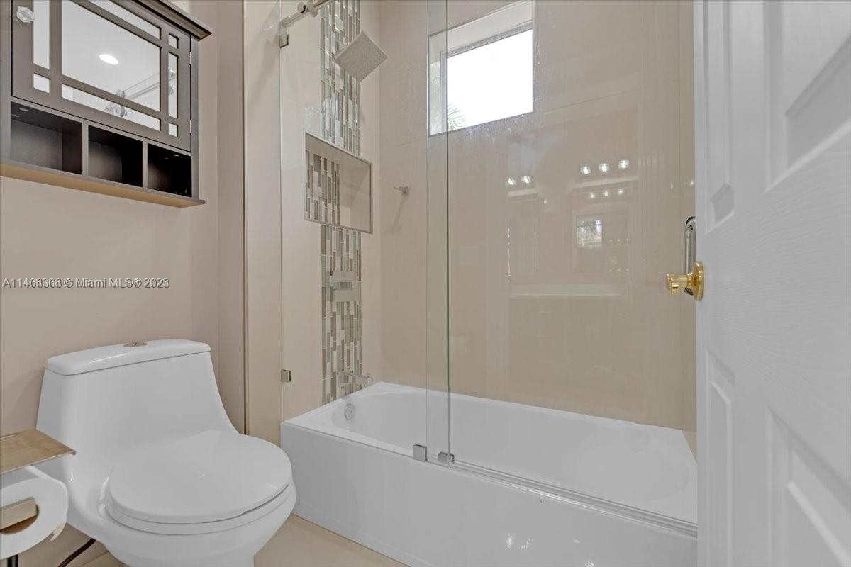 12441 Southwest 1st Street Plantation, FL 33325 - Photo 18 of 37 a bathroom with a toilet and a bathtub