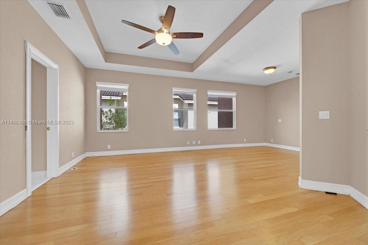 12441 Southwest 1st Street Plantation, FL 33325 - Photo 19 of 37 a view of an empty room with window and wooden floor