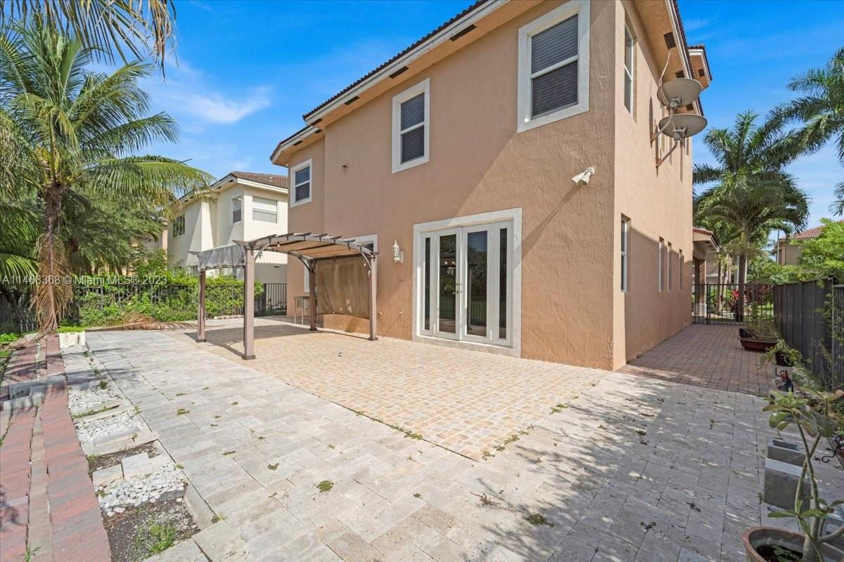 12441 Southwest 1st Street Plantation, FL 33325 - Photo 26 of 37 a view of a house with a patio