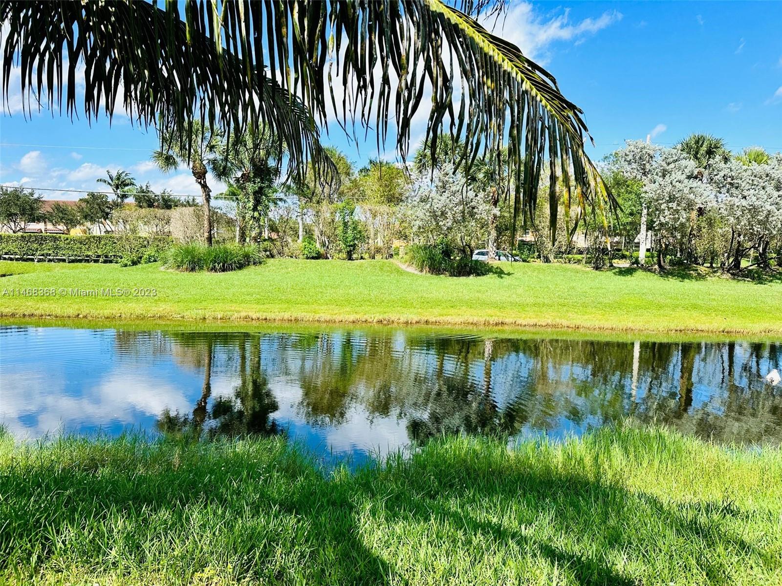 12441 Southwest 1st Street Plantation, FL 33325 - Photo 29 of 37 a view of a lake with a building in the background