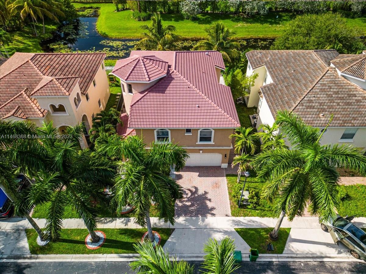 12441 Southwest 1st Street Plantation, FL 33325 - Photo 32 of 37 an aerial view of a house with garden space and a patio