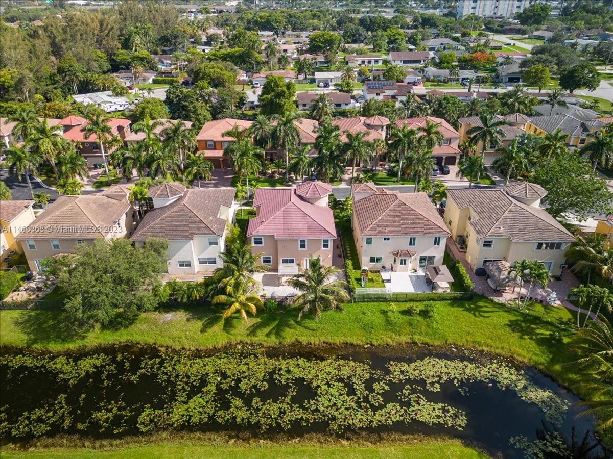 12441 Southwest 1st Street Plantation, FL 33325 - Photo 34 of 37 an aerial view of residential houses with outdoor space and trees