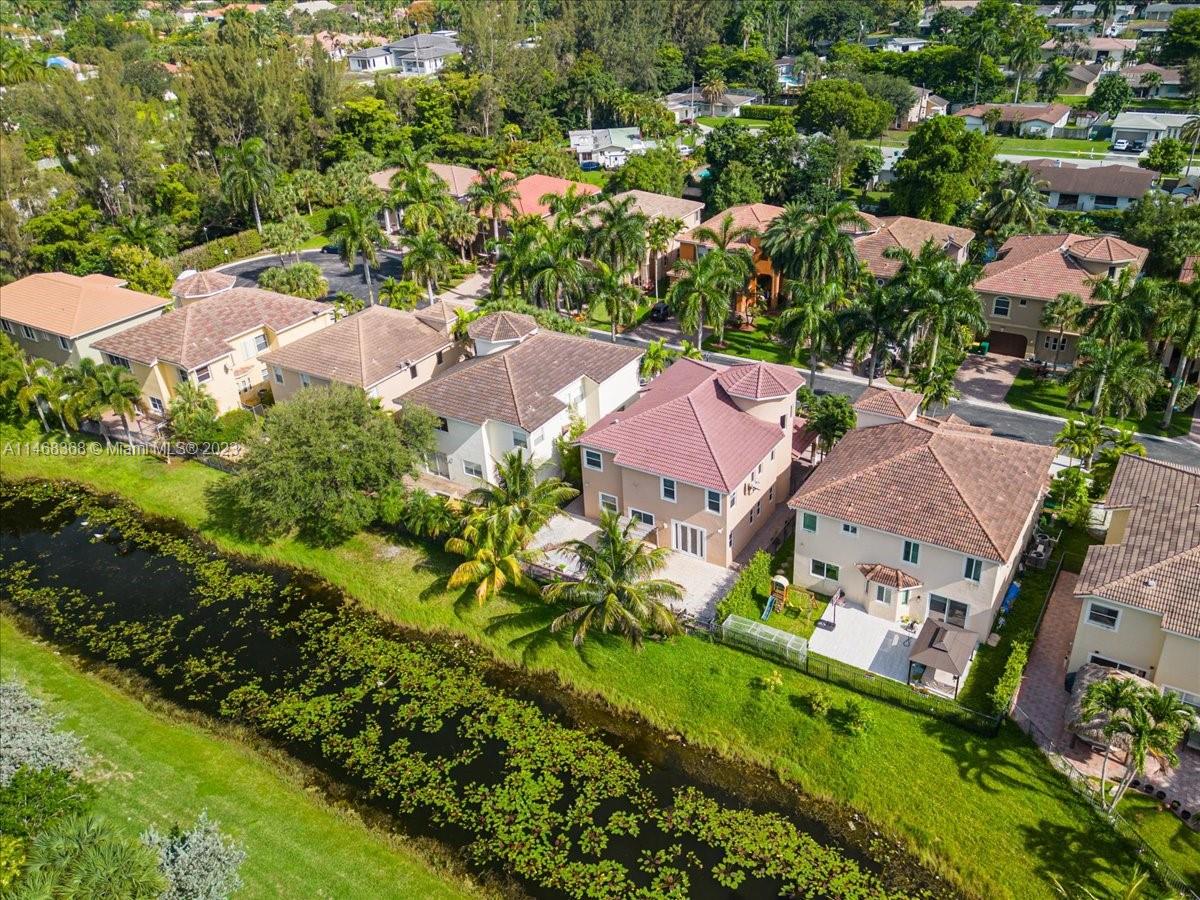 12441 Southwest 1st Street Plantation, FL 33325 - Photo 35 of 37 an aerial view of residential houses with outdoor space and trees all around