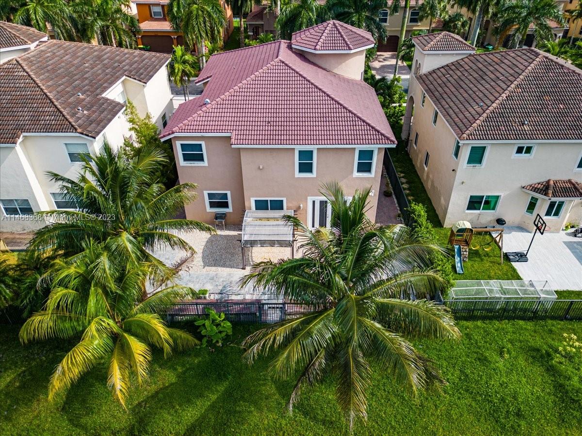 12441 Southwest 1st Street Plantation, FL 33325 - Photo 37 of 37 a front view of a house with garden