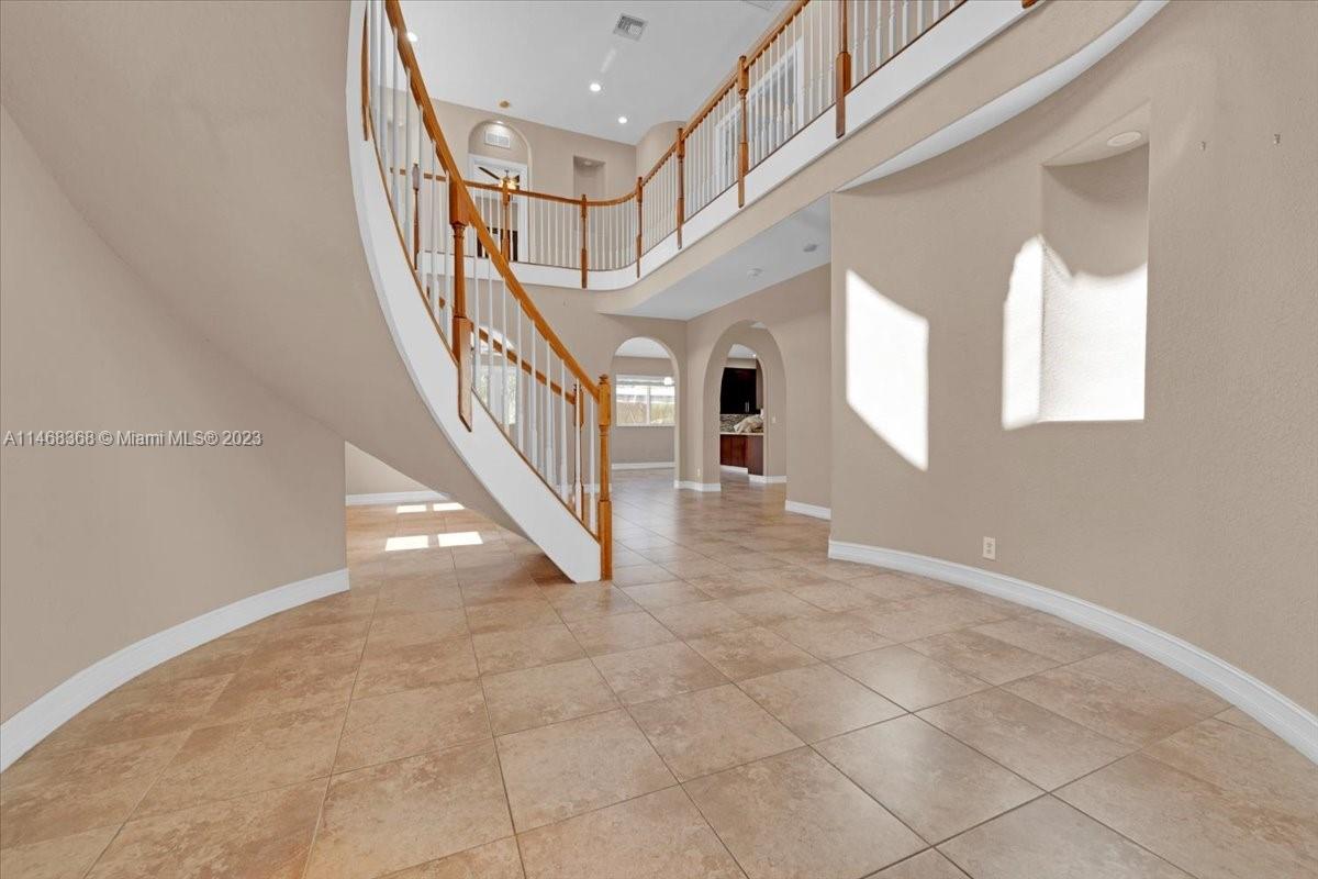 12441 Southwest 1st Street Plantation, FL 33325 - Photo 7 of 37 a view of entryway and hall with a window