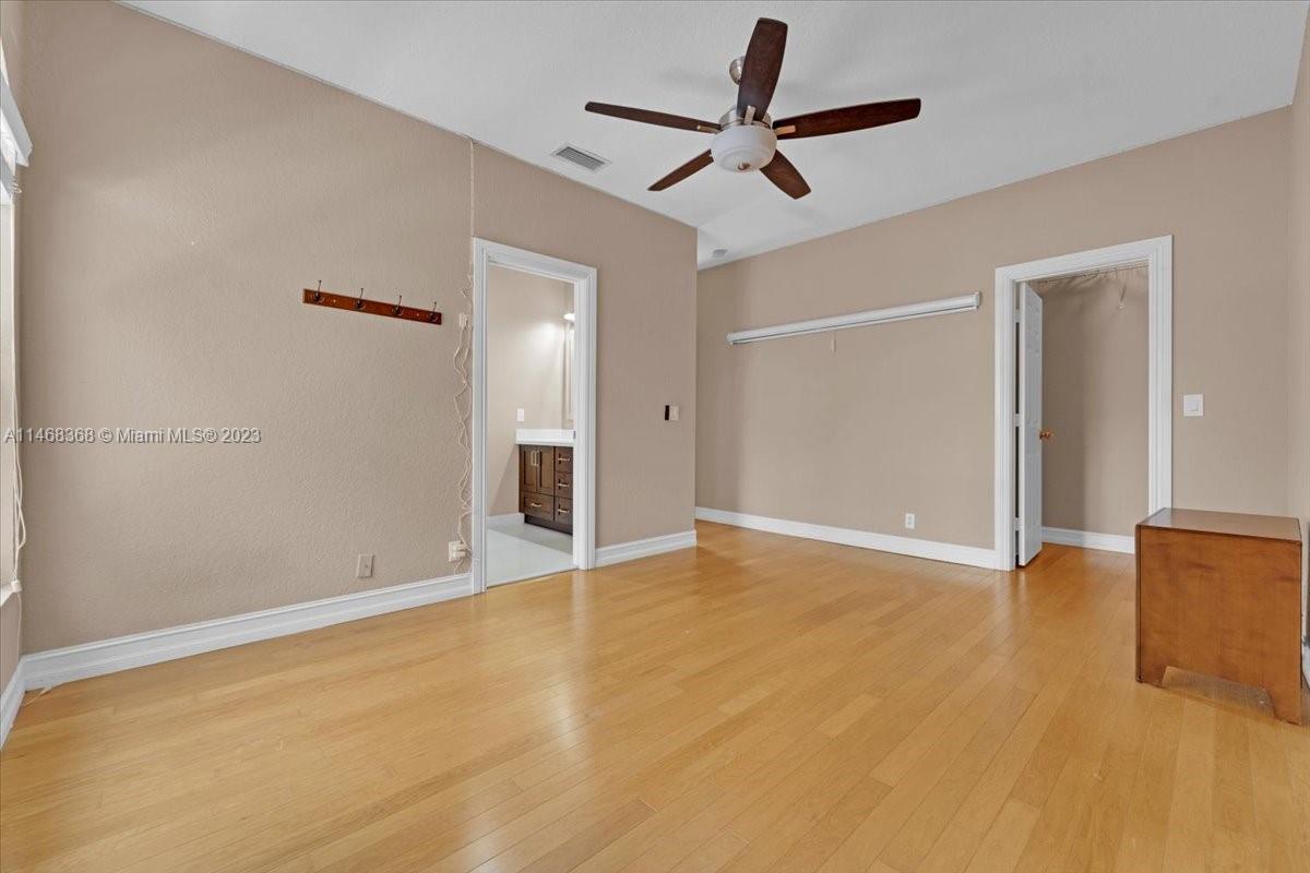 12441 Southwest 1st Street Plantation, FL 33325 - Photo 8 of 37 an empty room with ceiling fan and window