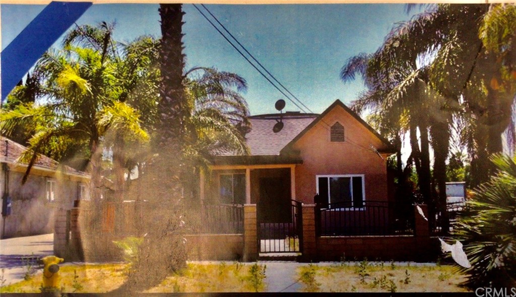 2956 5th Street Riverside, CA 92507 - Photo 1 of 1 front view of a house with a yard