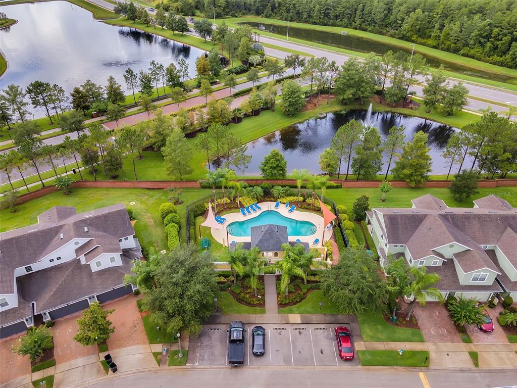 551 Terrace Spring Drive Orlando, FL 32828 - Photo 37 of 41 an aerial view of a house with a garden and lake view