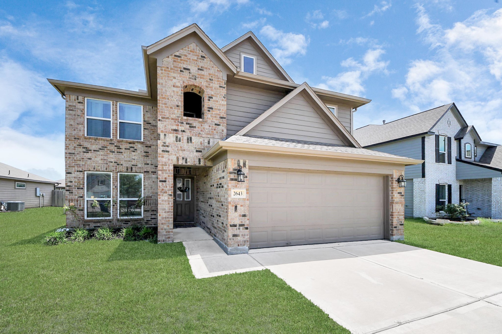 2643 Ridgeback Drive Rosenberg, TX 77471 - Photo 43 of 46 a front view of a house with a yard and garage