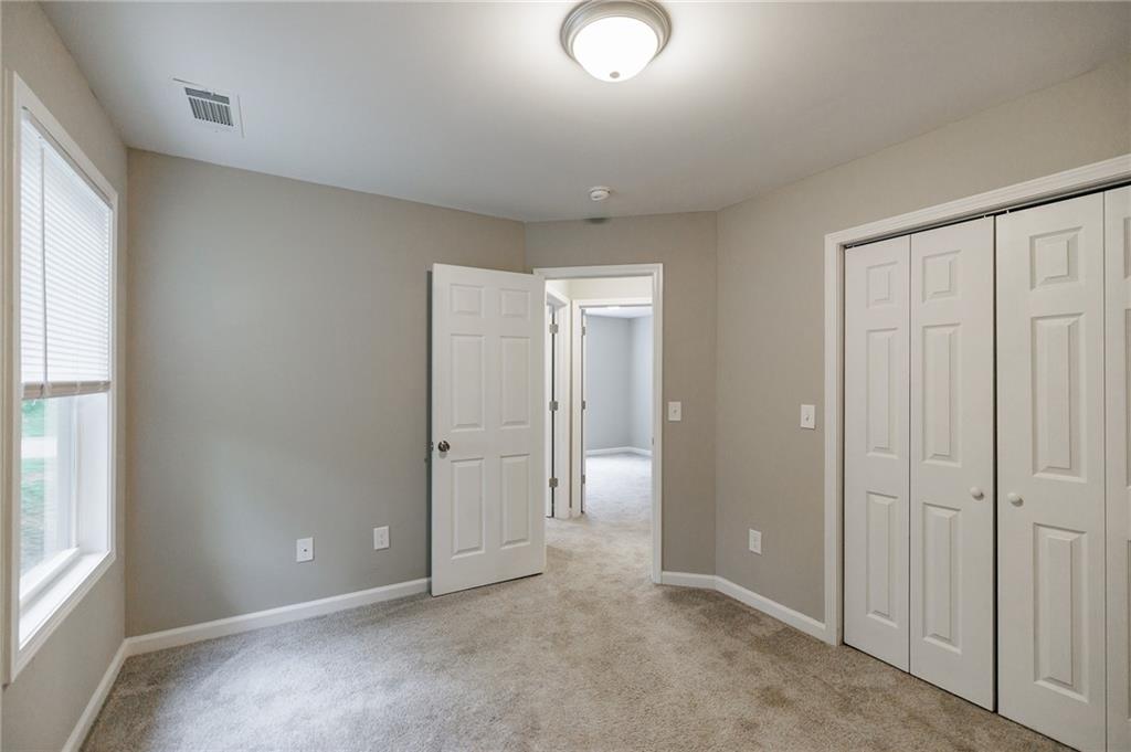 103 Three Rivers Court Hull, GA 30646 - Photo 34 of 40 an empty room with windows and closet