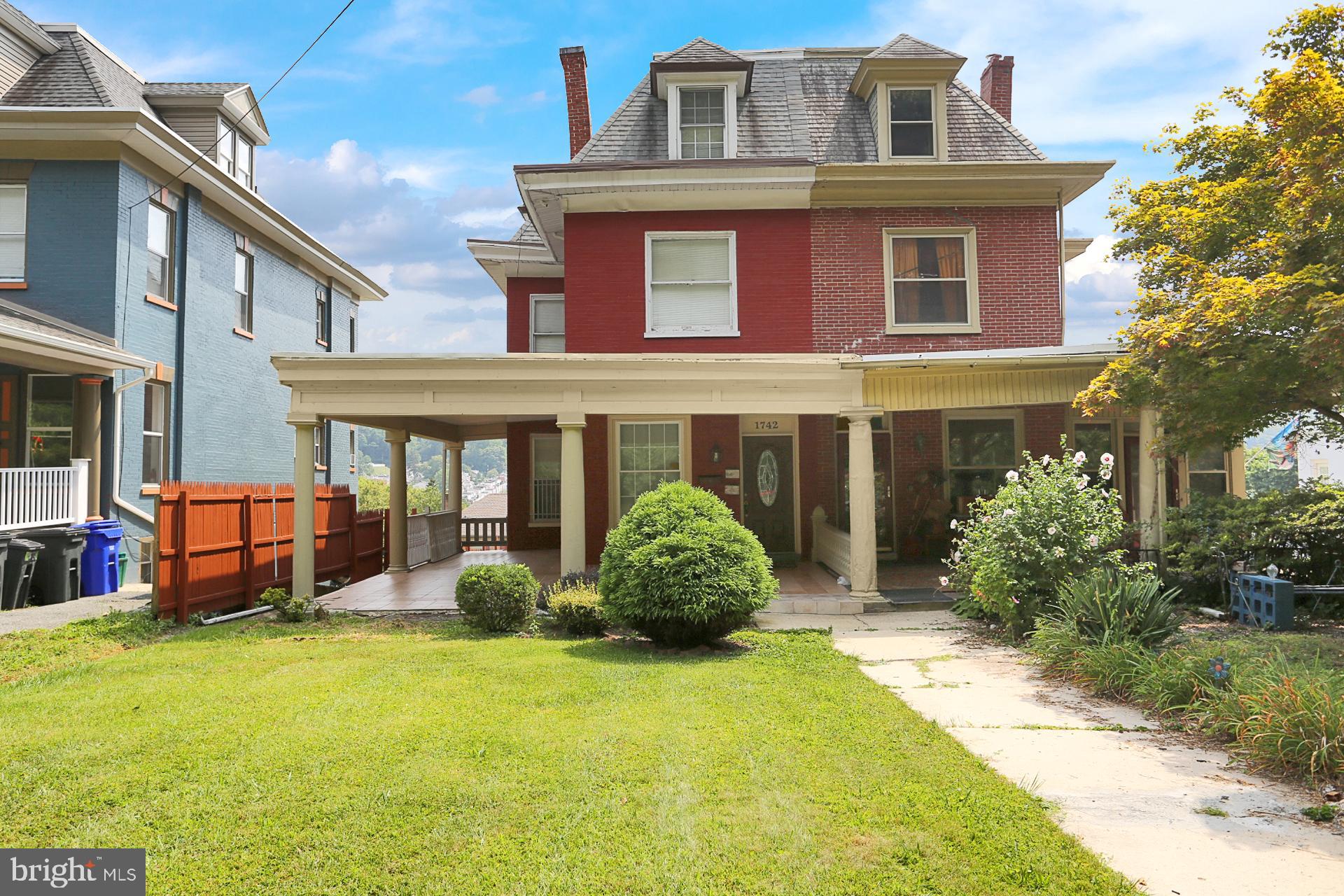 1742 Mineral Spring Road Reading, PA 19602 - Photo 1 of 31 a front view of a house with garden